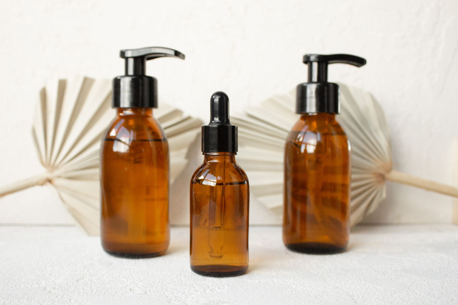 Amber glass bottles in soft natural light